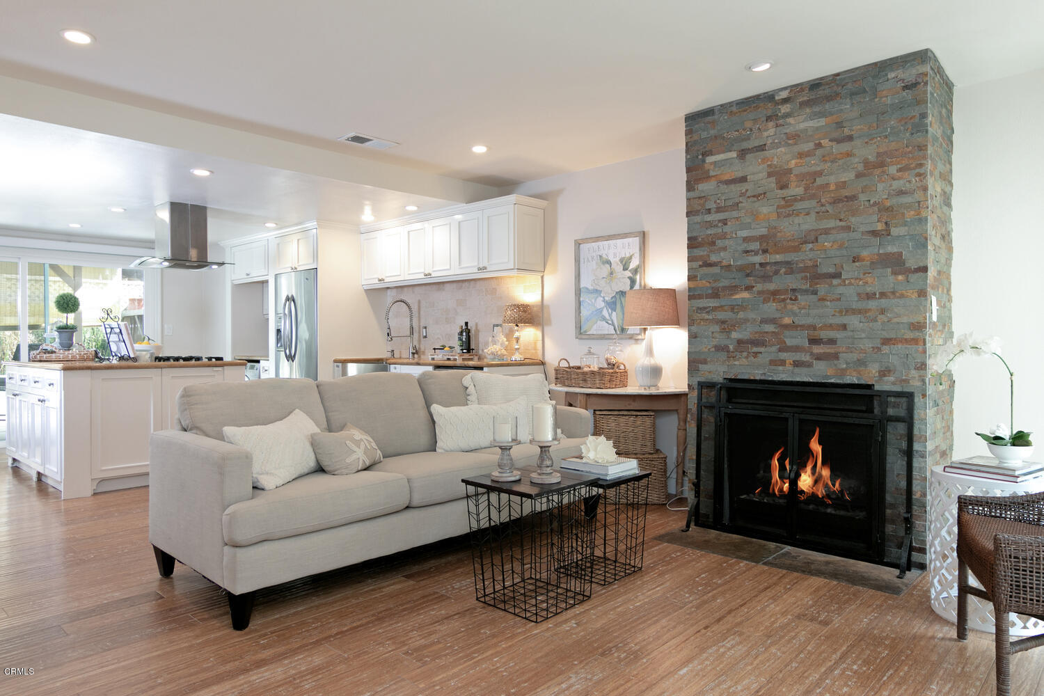 5120 West Wooley Road, Unit 2 Oxnard, CA 93035 - Photo 1 of 35 a living room with furniture and a fireplace