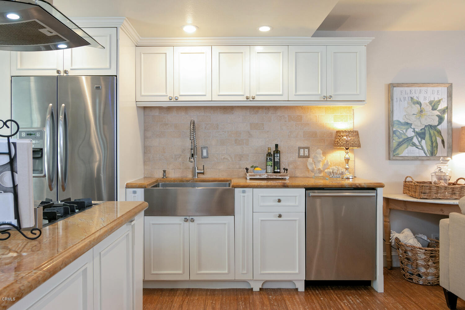 5120 West Wooley Road, Unit 2 Oxnard, CA 93035 - Photo 11 of 35 a kitchen with stainless steel appliances granite countertop a sink stove and refrigerator