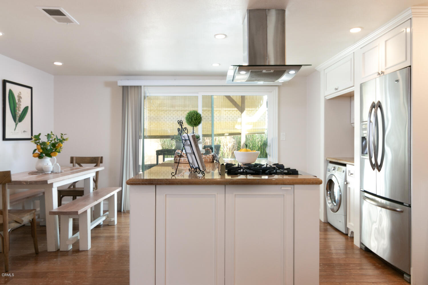 5120 West Wooley Road, Unit 2 Oxnard, CA 93035 - Photo 12 of 35 a kitchen with stainless steel appliances granite countertop a refrigerator and a stove