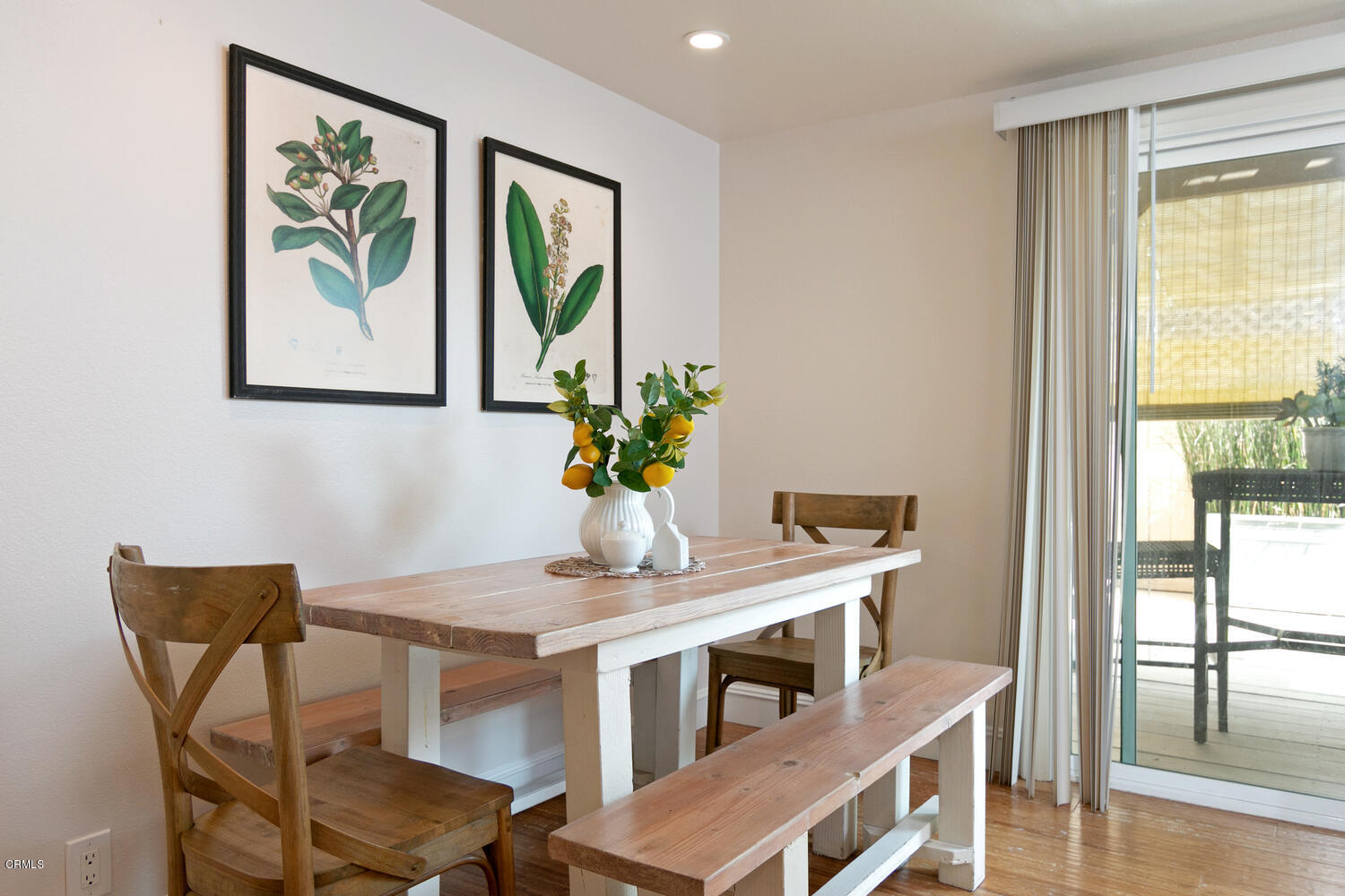 5120 West Wooley Road, Unit 2 Oxnard, CA 93035 - Photo 13 of 35 a view of a dining room with furniture window and wooden floor