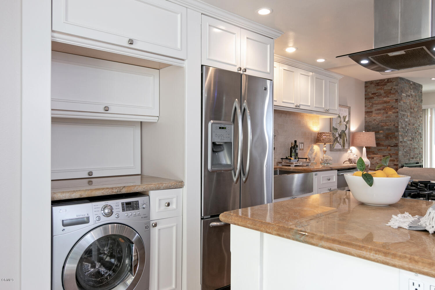 5120 West Wooley Road, Unit 2 Oxnard, CA 93035 - Photo 14 of 35 a kitchen with a refrigerator and a sink