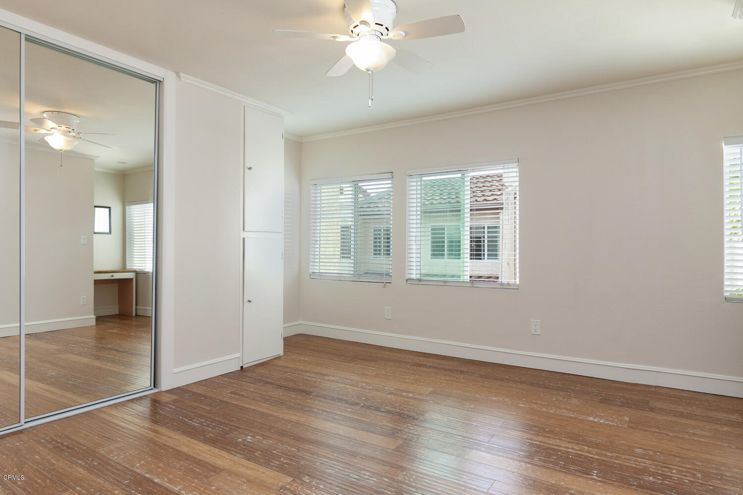 5120 West Wooley Road, Unit 2 Oxnard, CA 93035 - Photo 17 of 35 wooden floor in an empty room with a window