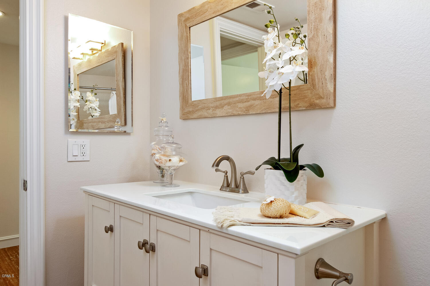 5120 West Wooley Road, Unit 2 Oxnard, CA 93035 - Photo 21 of 35 a bathroom with a sink and a mirror
