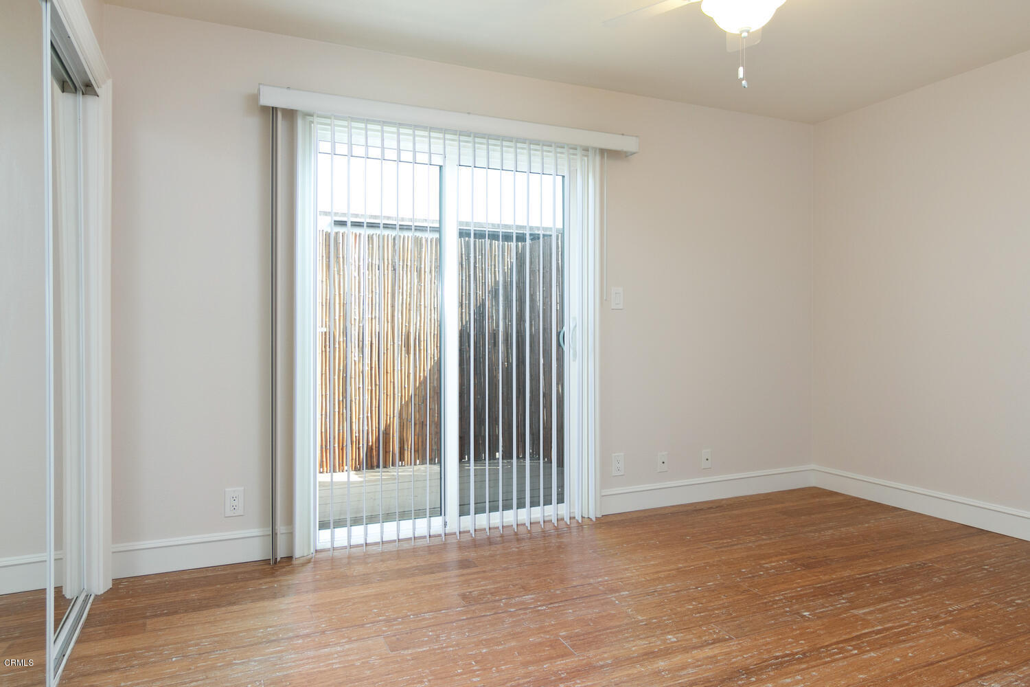 5120 West Wooley Road, Unit 2 Oxnard, CA 93035 - Photo 22 of 35 wooden floor in an empty room with a window