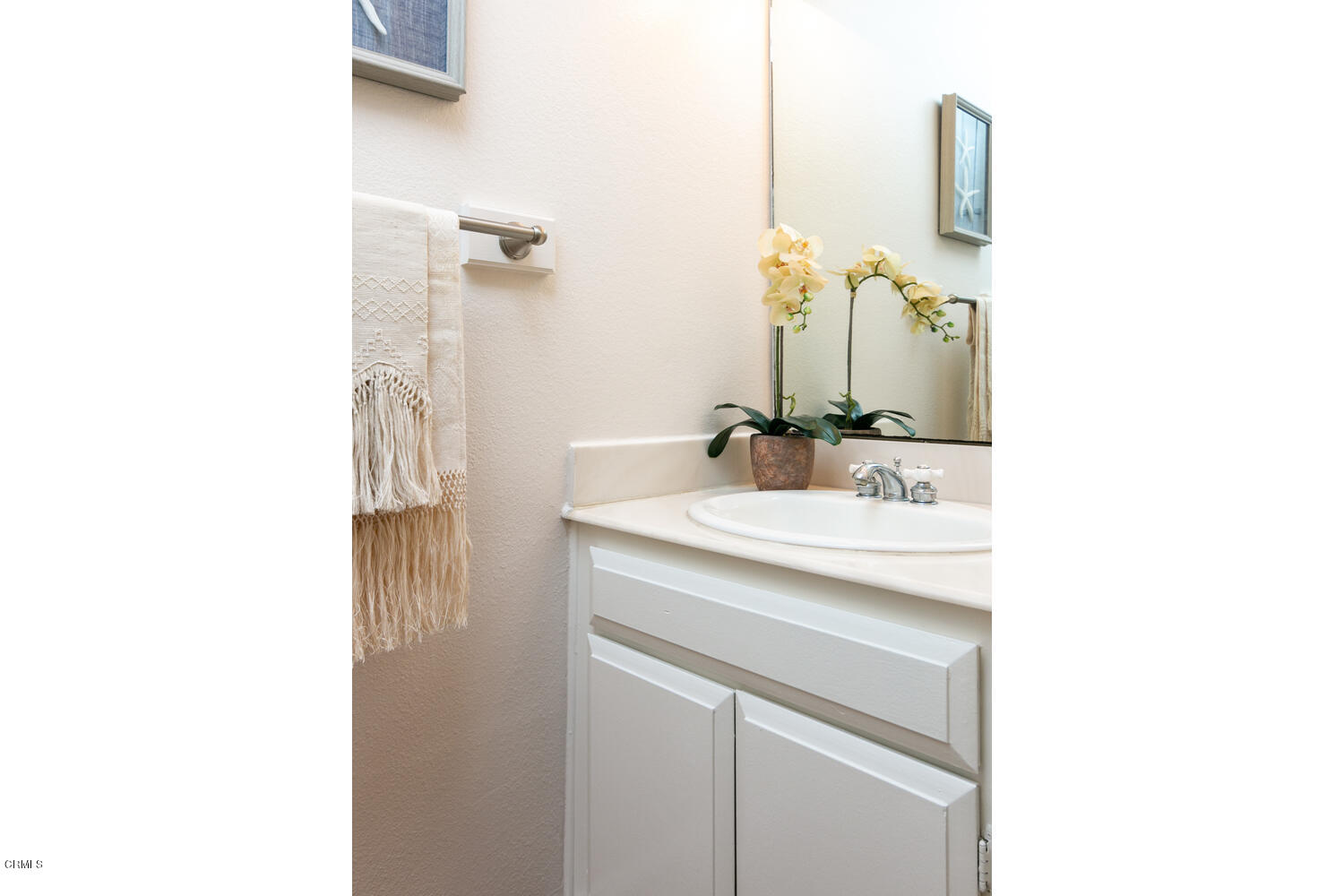 5120 West Wooley Road, Unit 2 Oxnard, CA 93035 - Photo 24 of 35 a bathroom with a sink and a mirror