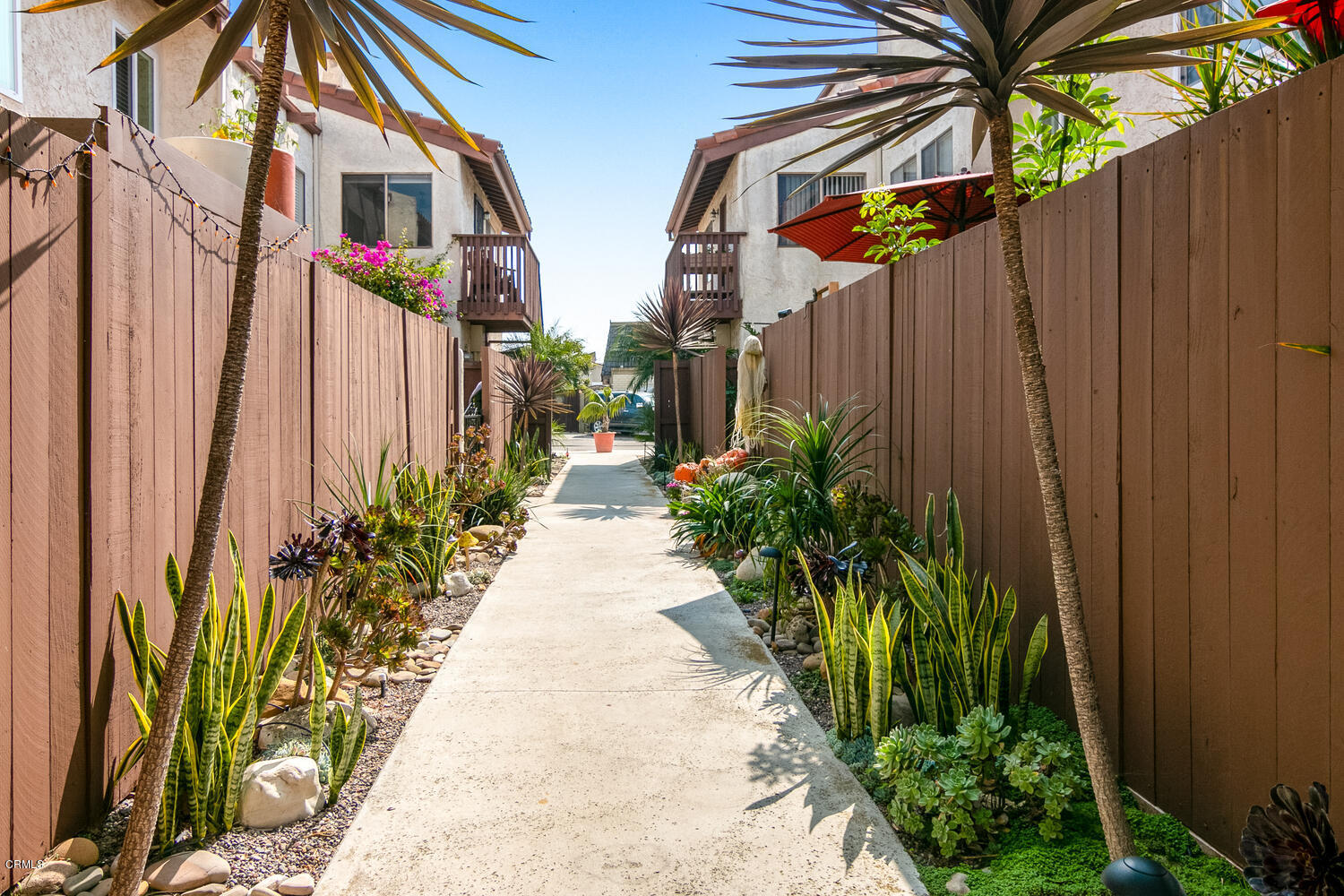 5120 West Wooley Road, Unit 2 Oxnard, CA 93035 - Photo 30 of 35 a view of a pathway along with wooden fence
