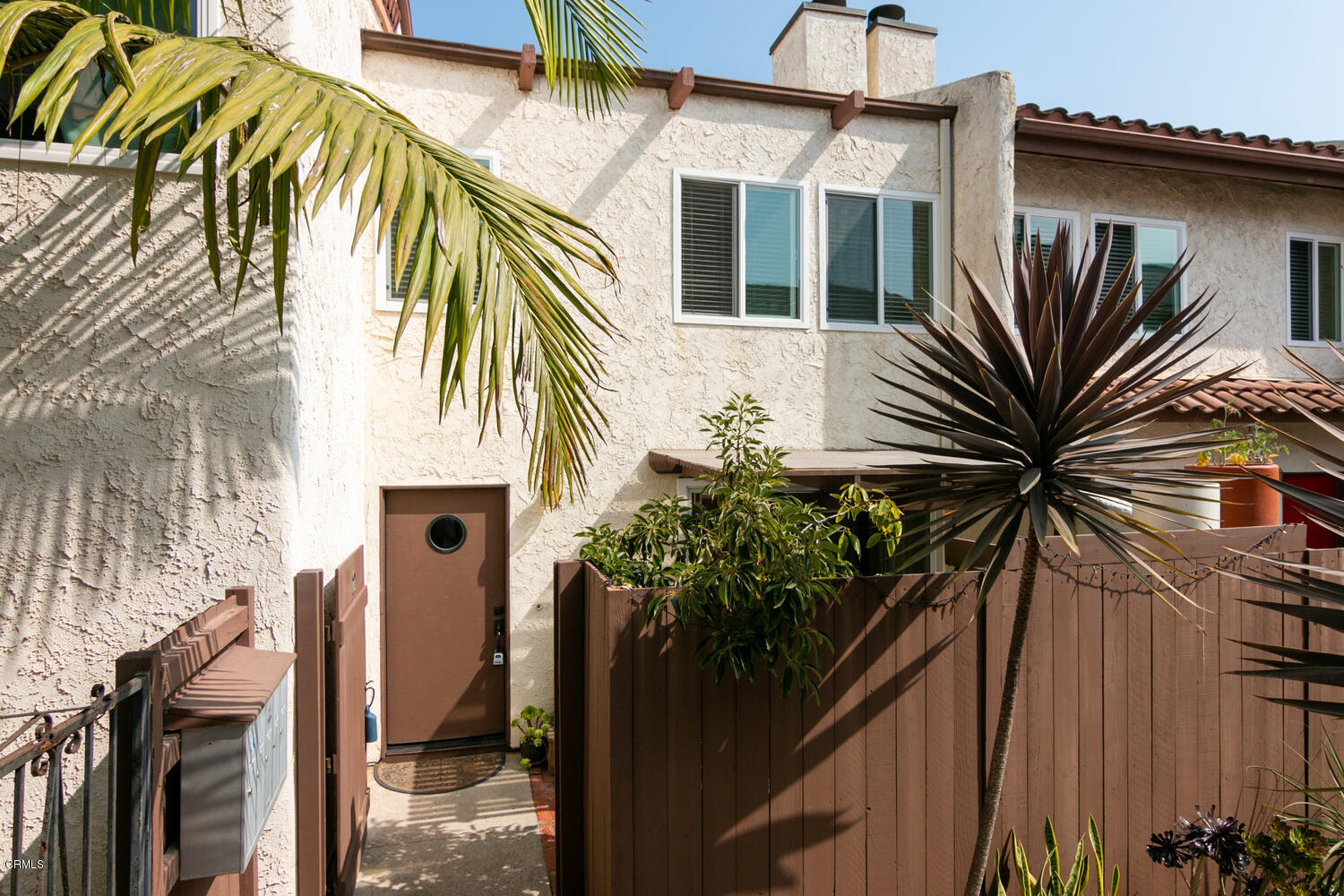 5120 West Wooley Road, Unit 2 Oxnard, CA 93035 - Photo 4 of 35 a view of a house with a tree
