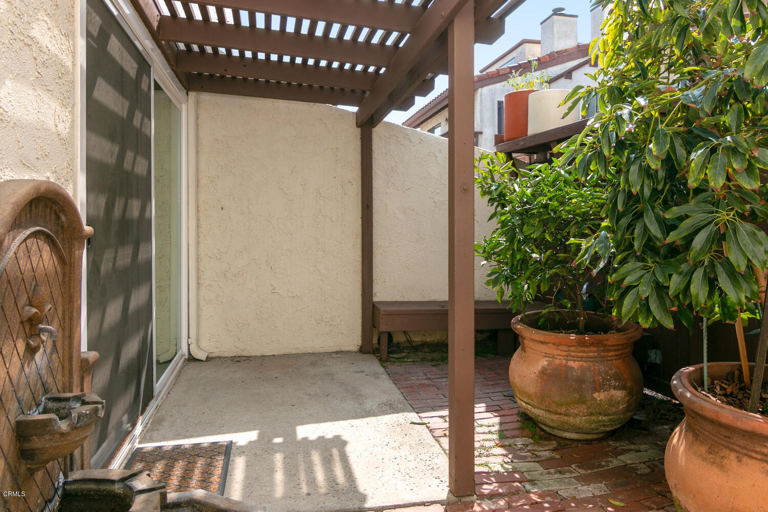 5120 West Wooley Road, Unit 2 Oxnard, CA 93035 - Photo 6 of 35 a view of a porch with potted plants