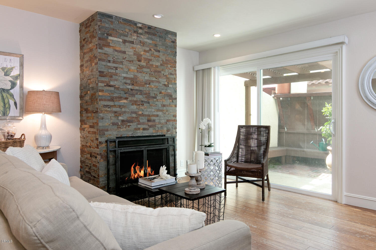 5120 West Wooley Road, Unit 2 Oxnard, CA 93035 - Photo 7 of 35 a living room with furniture and a fireplace