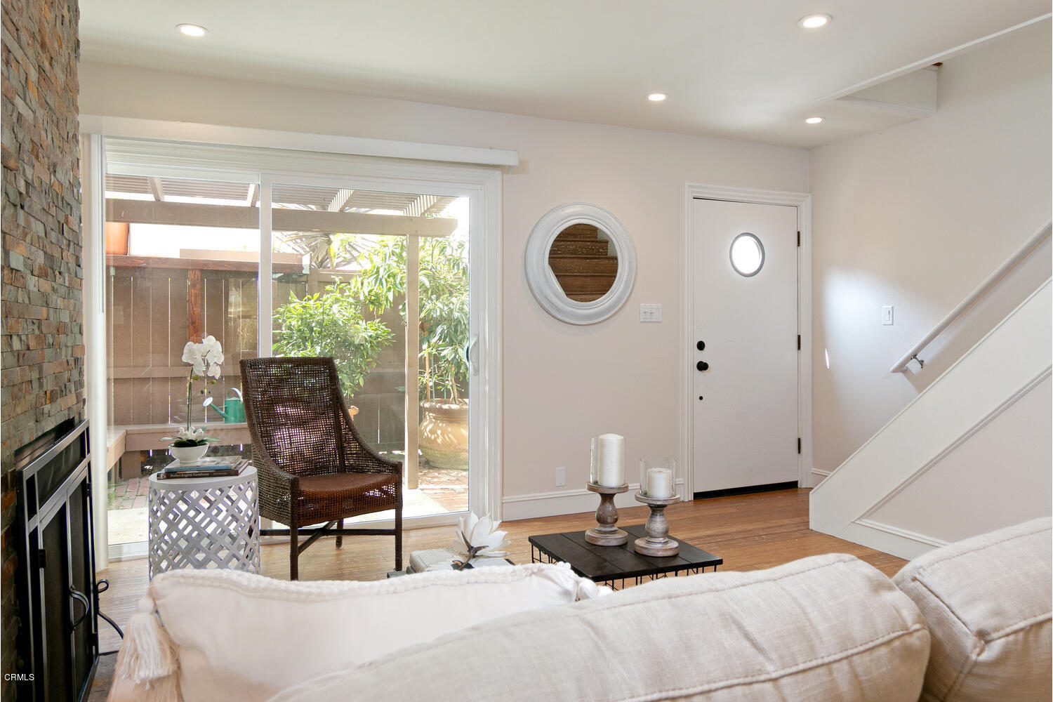5120 West Wooley Road, Unit 2 Oxnard, CA 93035 - Photo 9 of 35 a bed room with a bed a chair and a large window