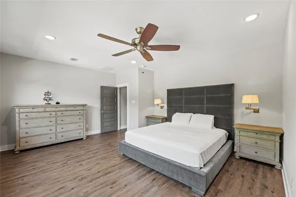 a bedroom with a bed and a dresser