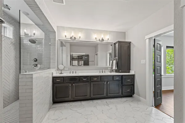 a utility room with sink dryer and washer