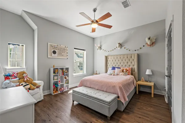 a bedroom with a bed and window