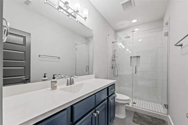 a living room with furniture and white walls
