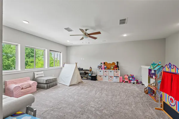a view of an house with backyard and porch