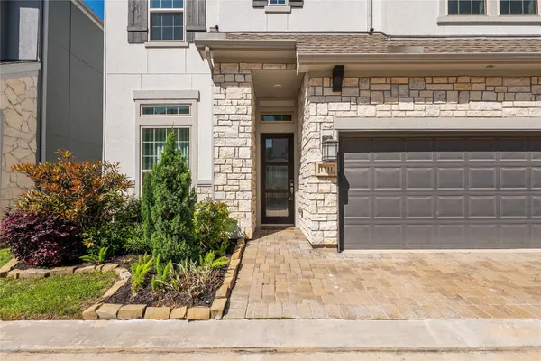 a front view of a building with garden
