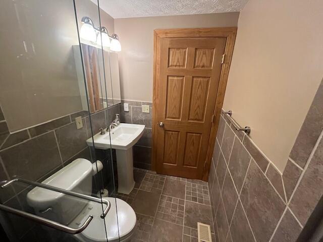 707 Cherry Hollow Road, Unit C Columbus, OH 43228 - Photo 2 of 21 View from inside shower to beautiful upgrades in the bathroom.