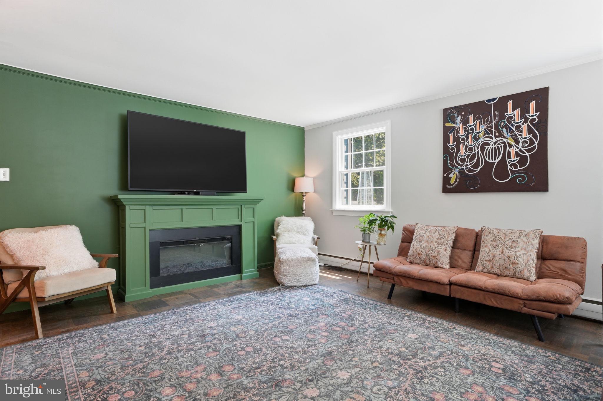 621 River Road Yardley, PA 19067 - Photo 15 of 75 a living room with furniture a fireplace and a flat screen tv