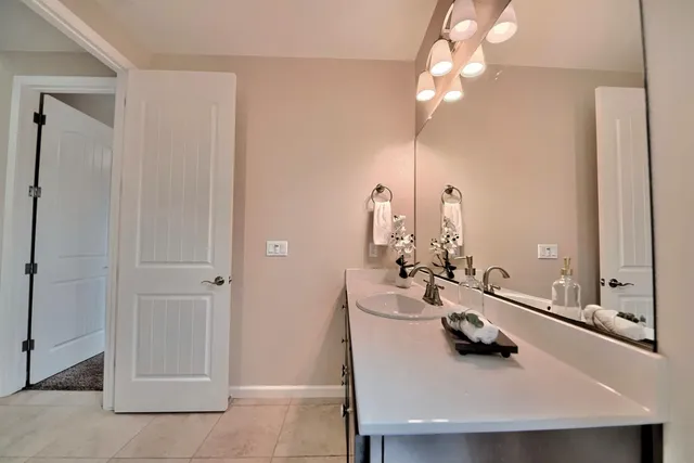 a living room with furniture and kitchen view