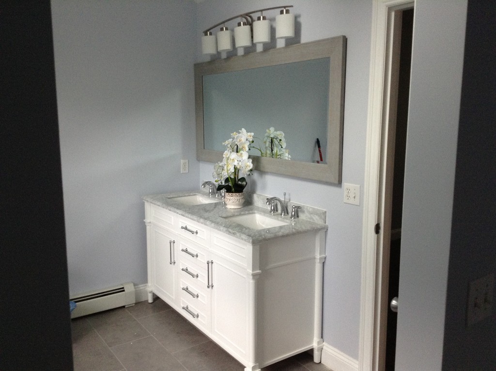 91 Haggerty Road Charlton, MA 01507 - Photo 11 of 15 a bathroom with a granite countertop sink and a mirror