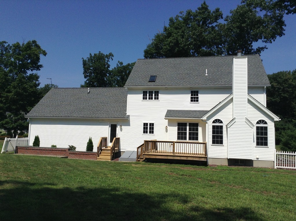 91 Haggerty Road Charlton, MA 01507 - Photo 14 of 15 a view of a house with a yard