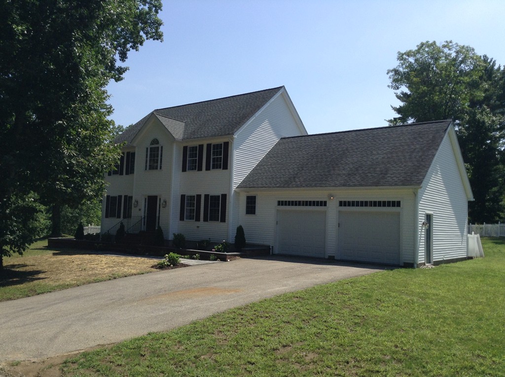 91 Haggerty Road Charlton, MA 01507 - Photo 2 of 15 a front view of a house with a yard