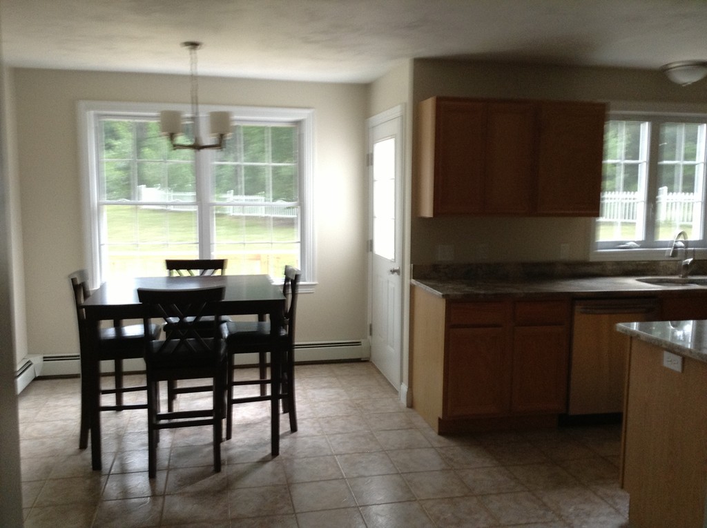 91 Haggerty Road Charlton, MA 01507 - Photo 5 of 15 a kitchen with a table and chairs in it
