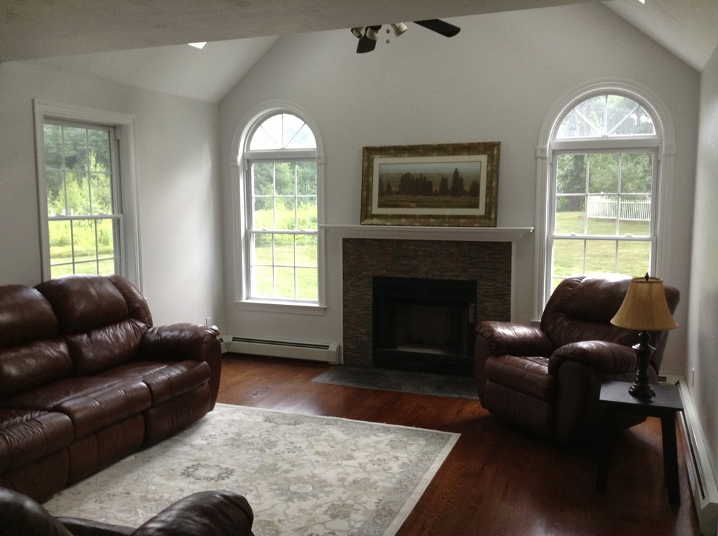 91 Haggerty Road Charlton, MA 01507 - Photo 7 of 15 a living room with furniture and a fireplace