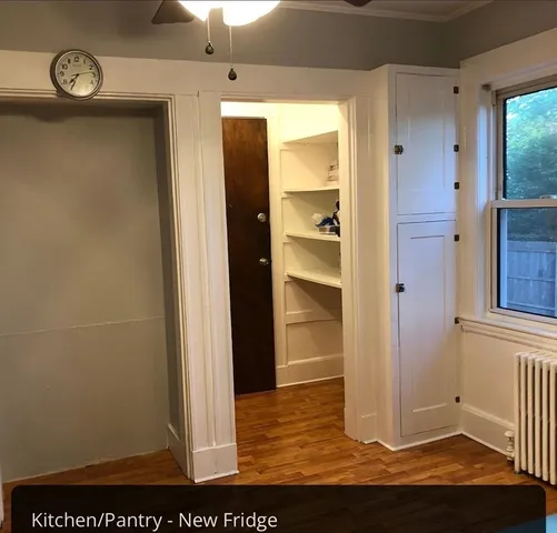a kitchen with a refrigerator sink stove and cabinets