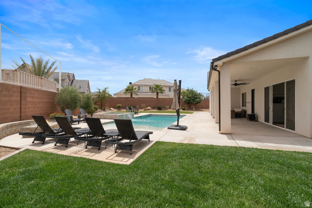 2278 Tawny Ridge Circle St. George, UT 84790 - Photo 53 of 61 Expansive outdoor living area featuring a swimming pool, integrated spa, and concrete patio.