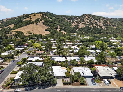 an aerial view of residential houses with outdoor space