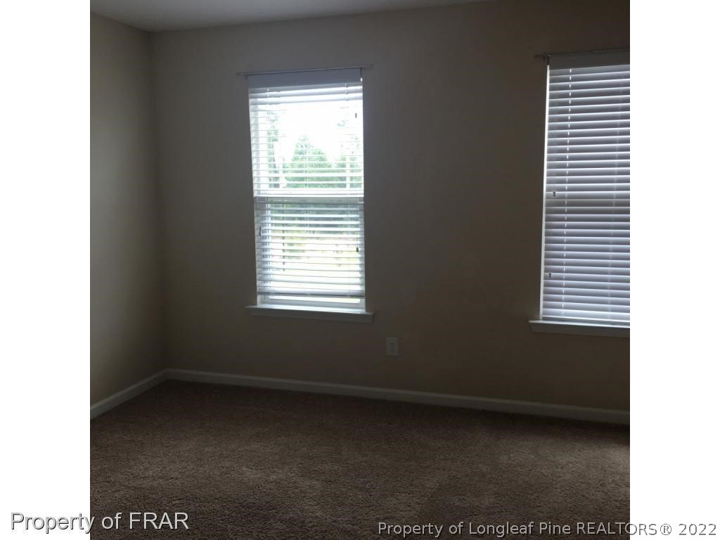 434 New Castle Lane Spring Lake, NC 28390 - Photo 11 of 12 a view of an empty room with a window
