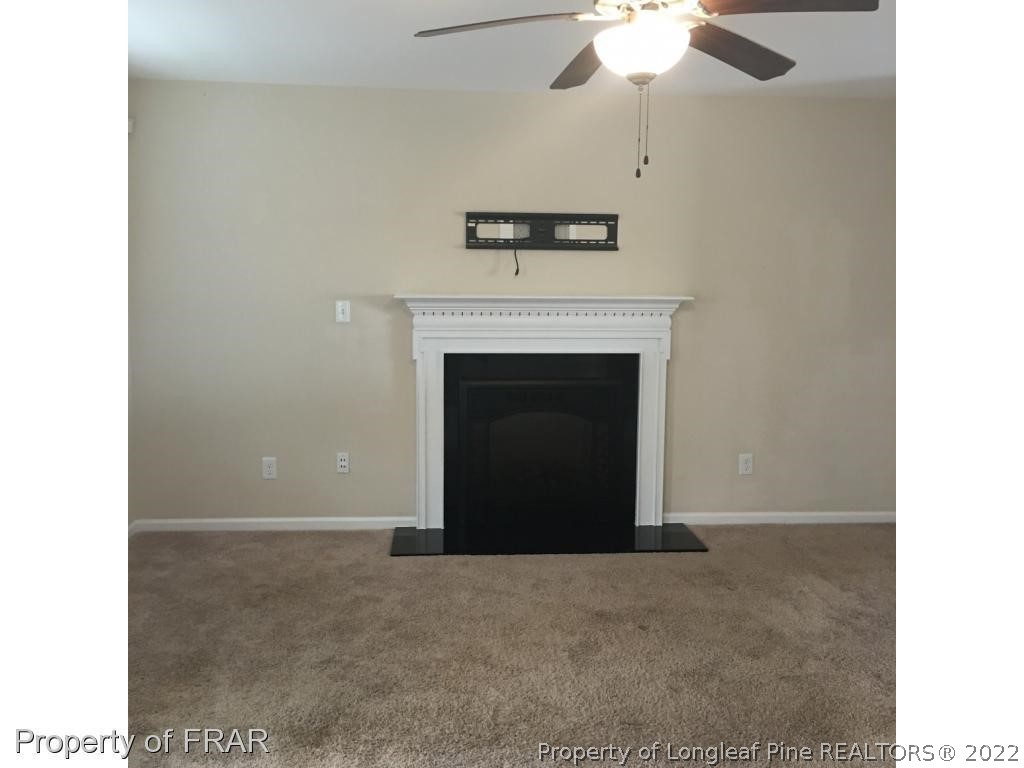 434 New Castle Lane Spring Lake, NC 28390 - Photo 2 of 12 a view of an empty room with a fireplace