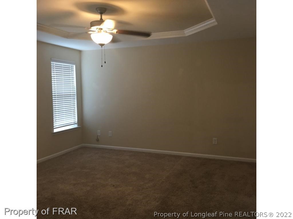 434 New Castle Lane Spring Lake, NC 28390 - Photo 6 of 12 a view of an empty room with a window