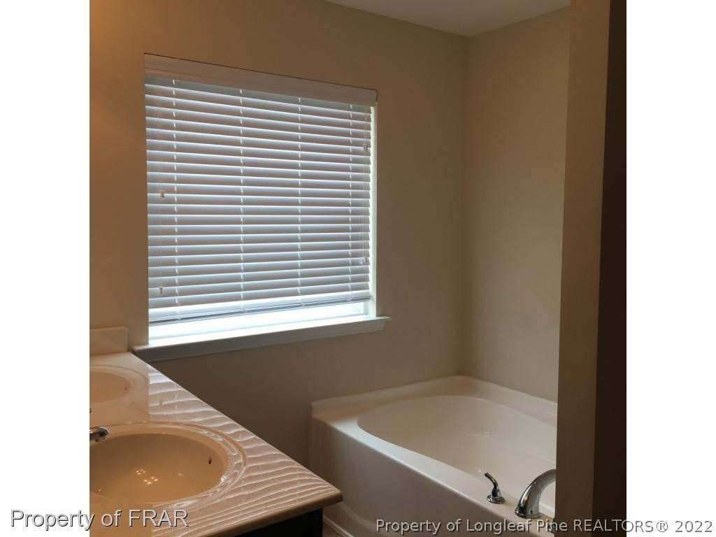 434 New Castle Lane Spring Lake, NC 28390 - Photo 7 of 12 a view of a bathtub in a bathroom