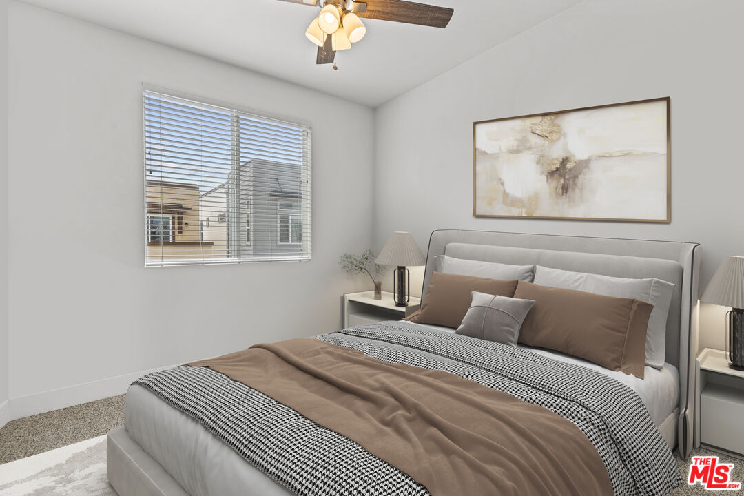 625 Daniel Freeman Circle Inglewood, CA 90301 - Photo 19 of 23 a bedroom with a bed and a painting on the wall