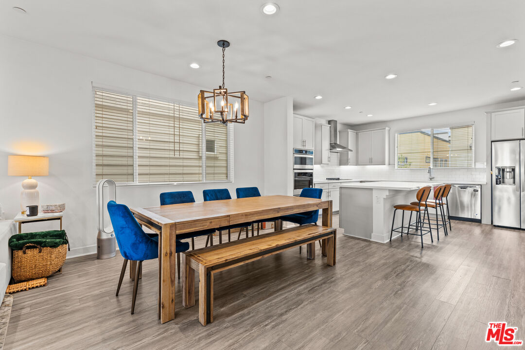 625 Daniel Freeman Circle Inglewood, CA 90301 - Photo 9 of 23 a dining room with furniture and wooden floor