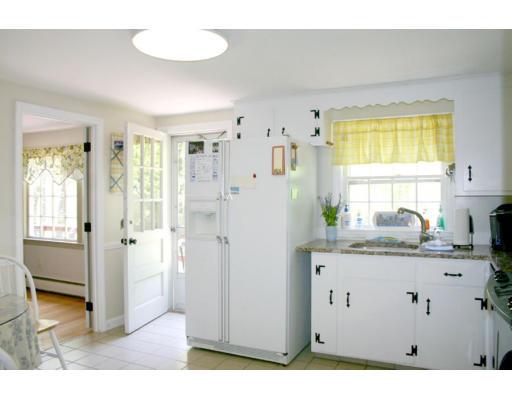 18 White Road Wayland, MA 01778 - Photo 11 of 19 a bathroom with a granite countertop sink a mirror and a bathtub