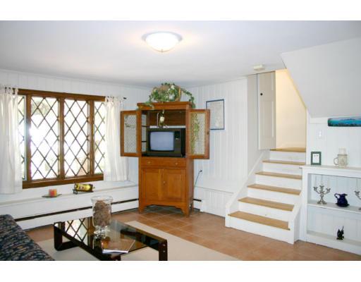18 White Road Wayland, MA 01778 - Photo 5 of 19 a living room with furniture and a flat screen tv