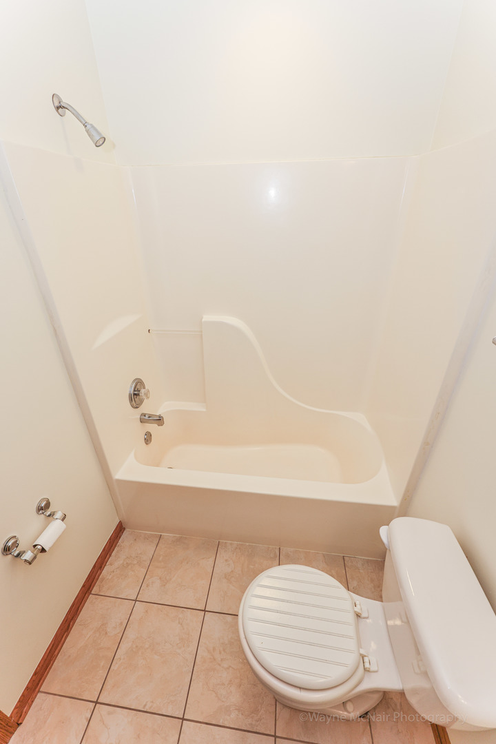 206 1/2 Redbud Drive Joliet, IL 60433 - Photo 20 of 34 a bathroom with a sink a toilet and bathtub