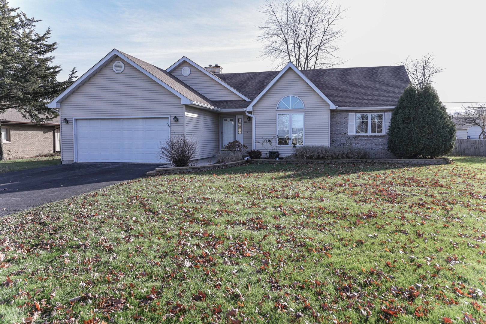 206 1/2 Redbud Drive Joliet, IL 60433 - Photo 3 of 34 a front view of a house with a yard