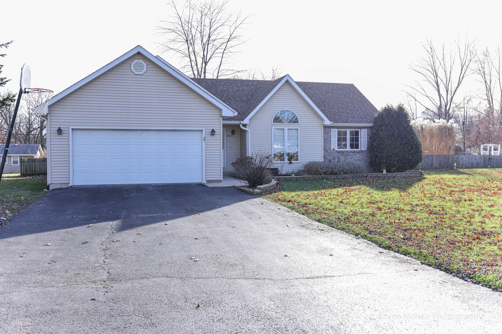 206 1/2 Redbud Drive Joliet, IL 60433 - Photo 4 of 34 a front view of a house with a yard and garage