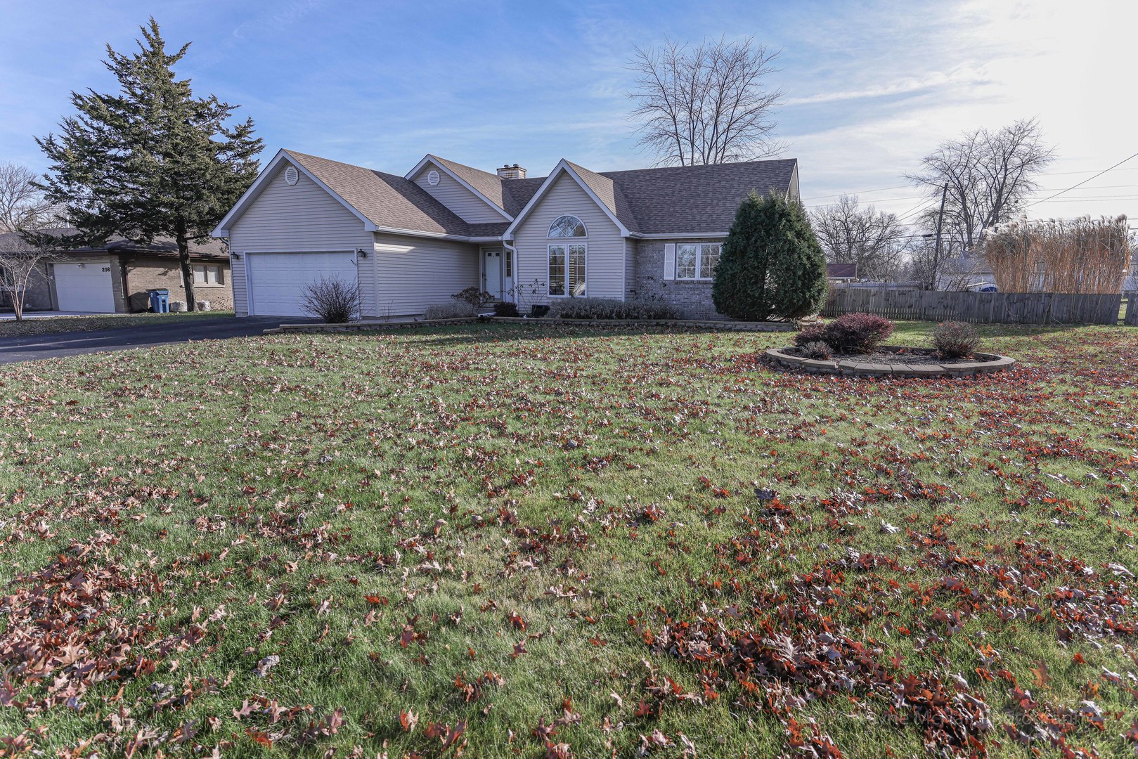 206 1/2 Redbud Drive Joliet, IL 60433 - Photo 5 of 34 a view of a house with a yard