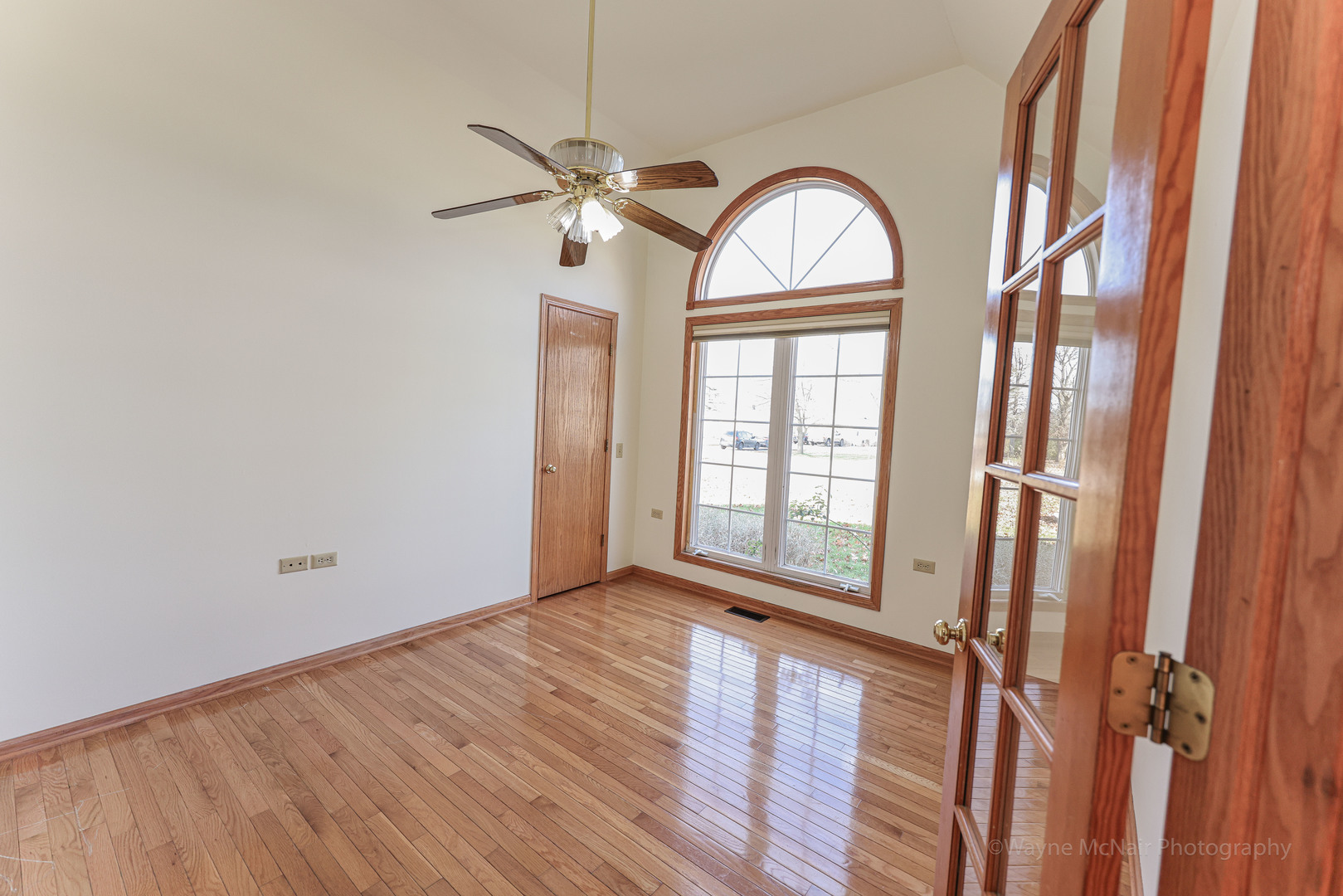 206 1/2 Redbud Drive Joliet, IL 60433 - Photo 7 of 34 wooden floor in an empty room with a window