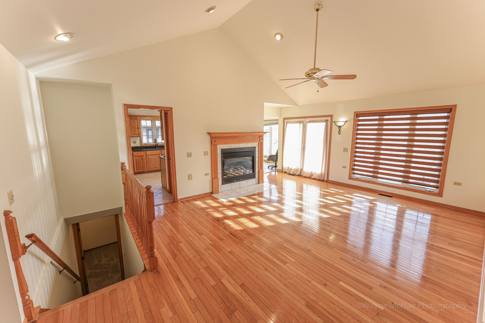 206 1/2 Redbud Drive Joliet, IL 60433 - Photo 8 of 34 a view of a livingroom with wooden floor and a ceiling fan