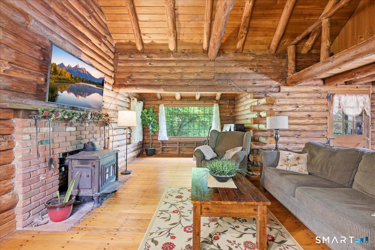 115 Green Hill Road Killingworth, CT 06419 - Photo 12 of 40 Open living area with rustic charm