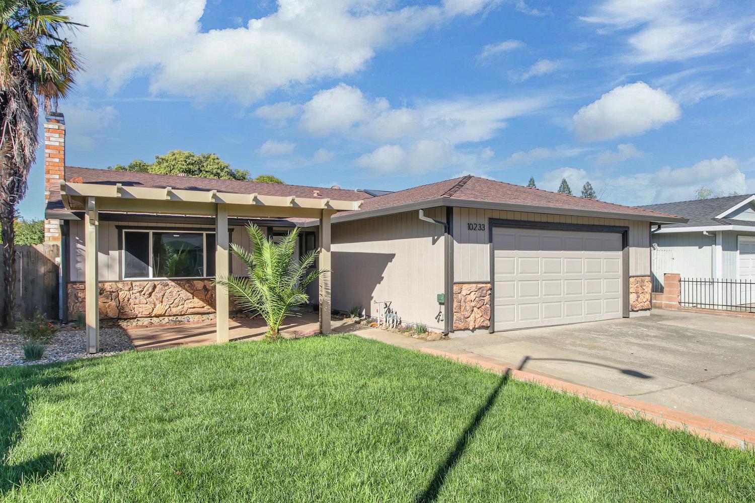 10233 Countryside Way Sacramento, CA 95827 - Photo 1 of 1 a view of a house with a yard and front view of a house