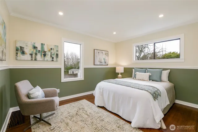 a bedroom with a bed and a chair