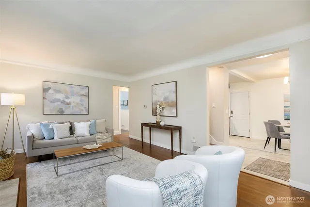 a living room with furniture and a table