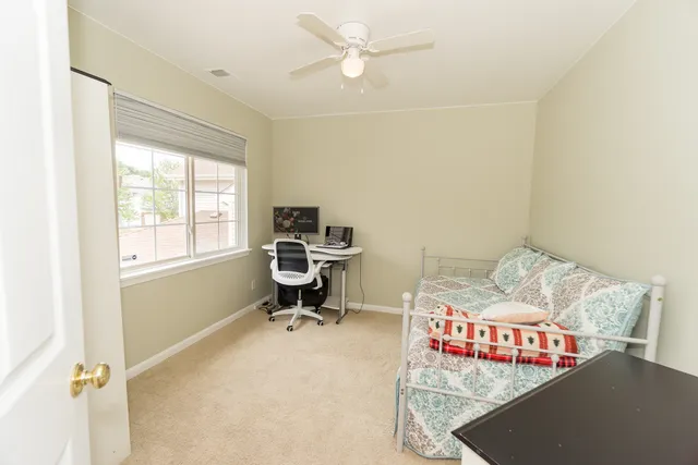 a bedroom with a workspace